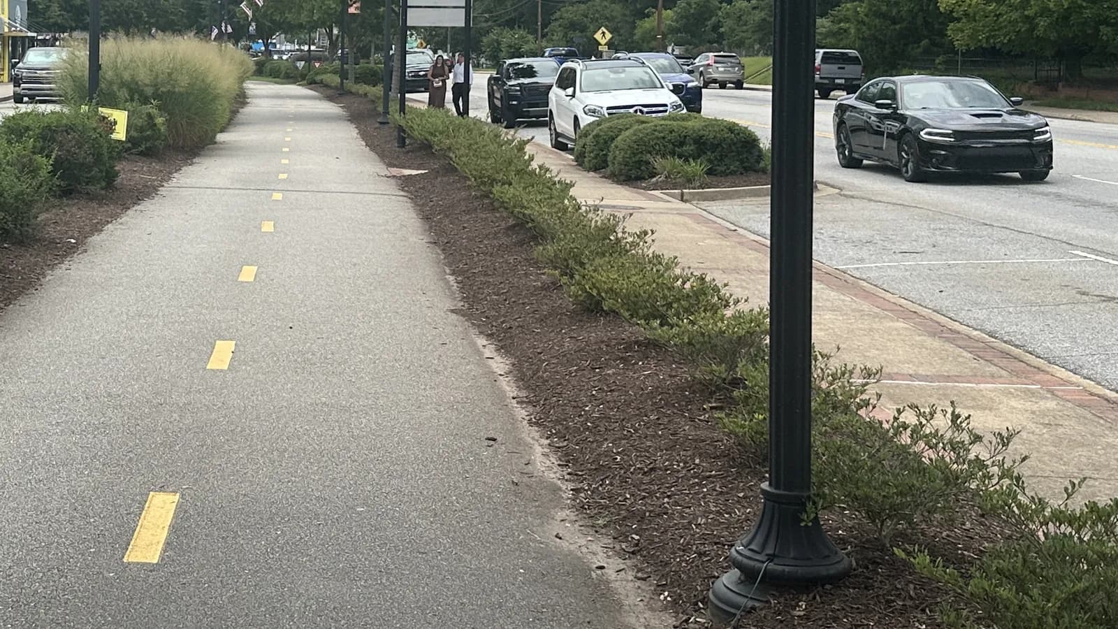 The paved Swamp Rabbit Trail running alongside Main Street through downtown Travelers Rest, South Carolina