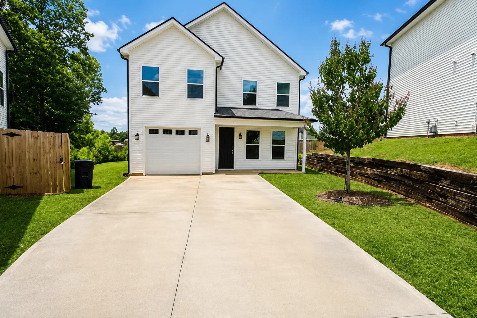 Exterior of the Fairmont, a two story home with an attached garage and driveway in Travelers Rest, SC