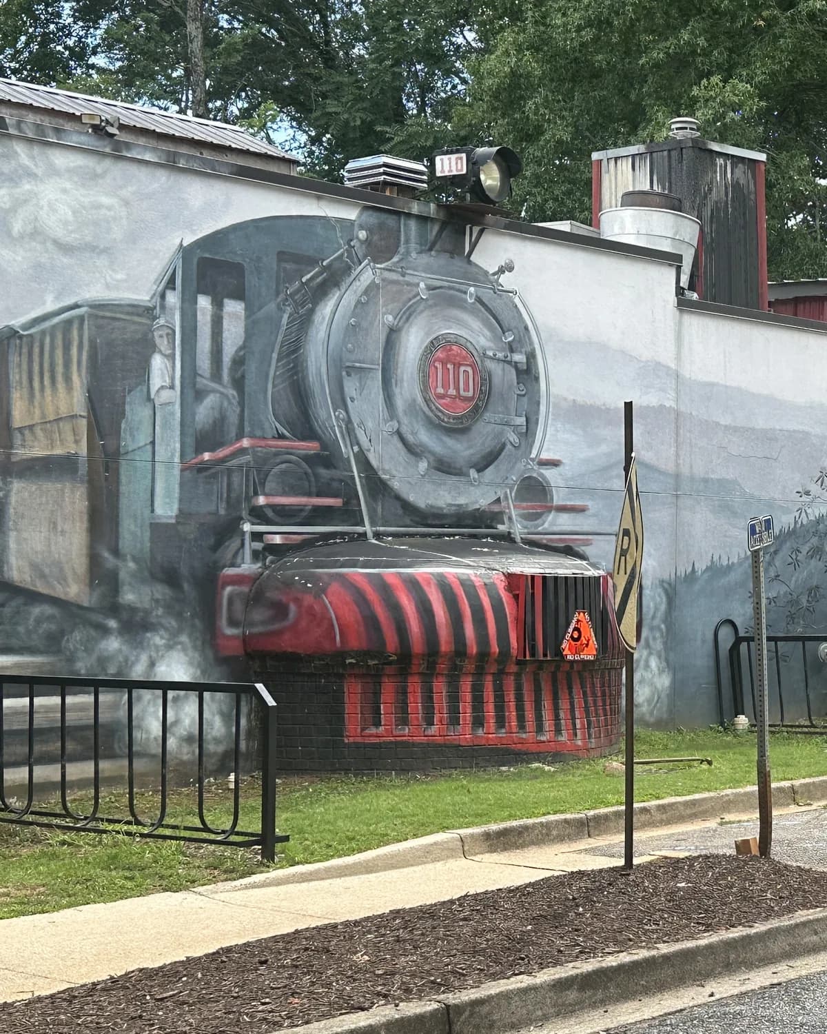 Mural of the number 110 steam locomotive painted on a downtown building in Travelers Rest, South Carolina