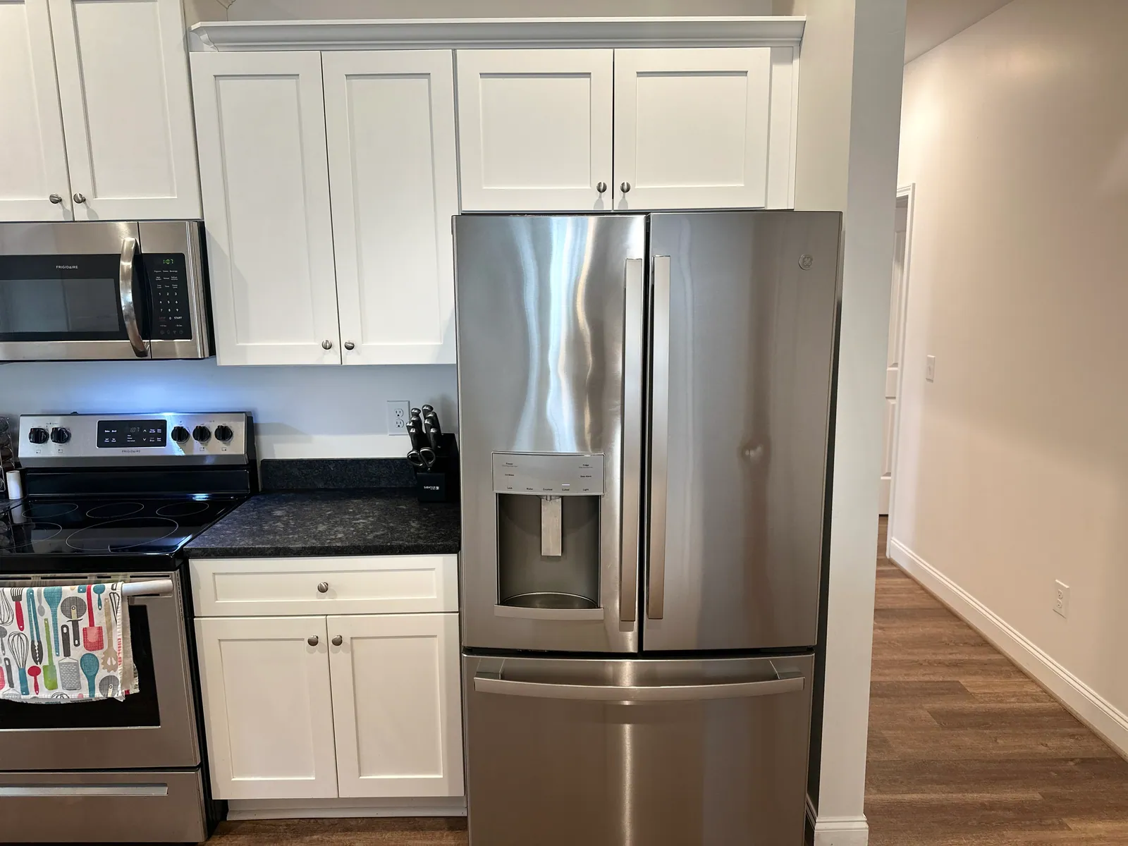 Shaker kitchen with granite counters and stainless appliances at 2 Solis Court